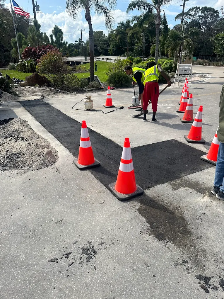Asphalt patch repair marked with cones